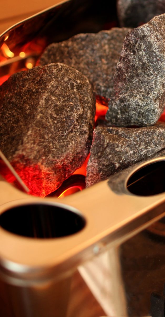 STAINLESS SAWO SAUNA HEATER DIABASE STONES CLOSEUP 1200627 STAINLESS SAWO SAUNA HEATER FINNISH OLIVINE DIABASE STONES CLOSEUP